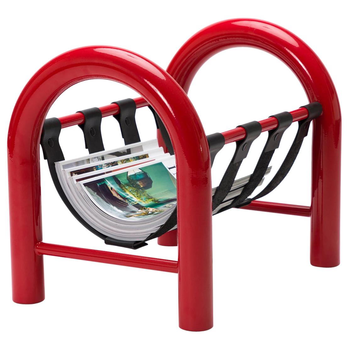 The tubular magazine rack is a lightweight yet durable magazine rack perfect for holding any reading materials you want at the ready, while injecting a sense of thoughtful design into a space.

This limited edition red frame with black leather