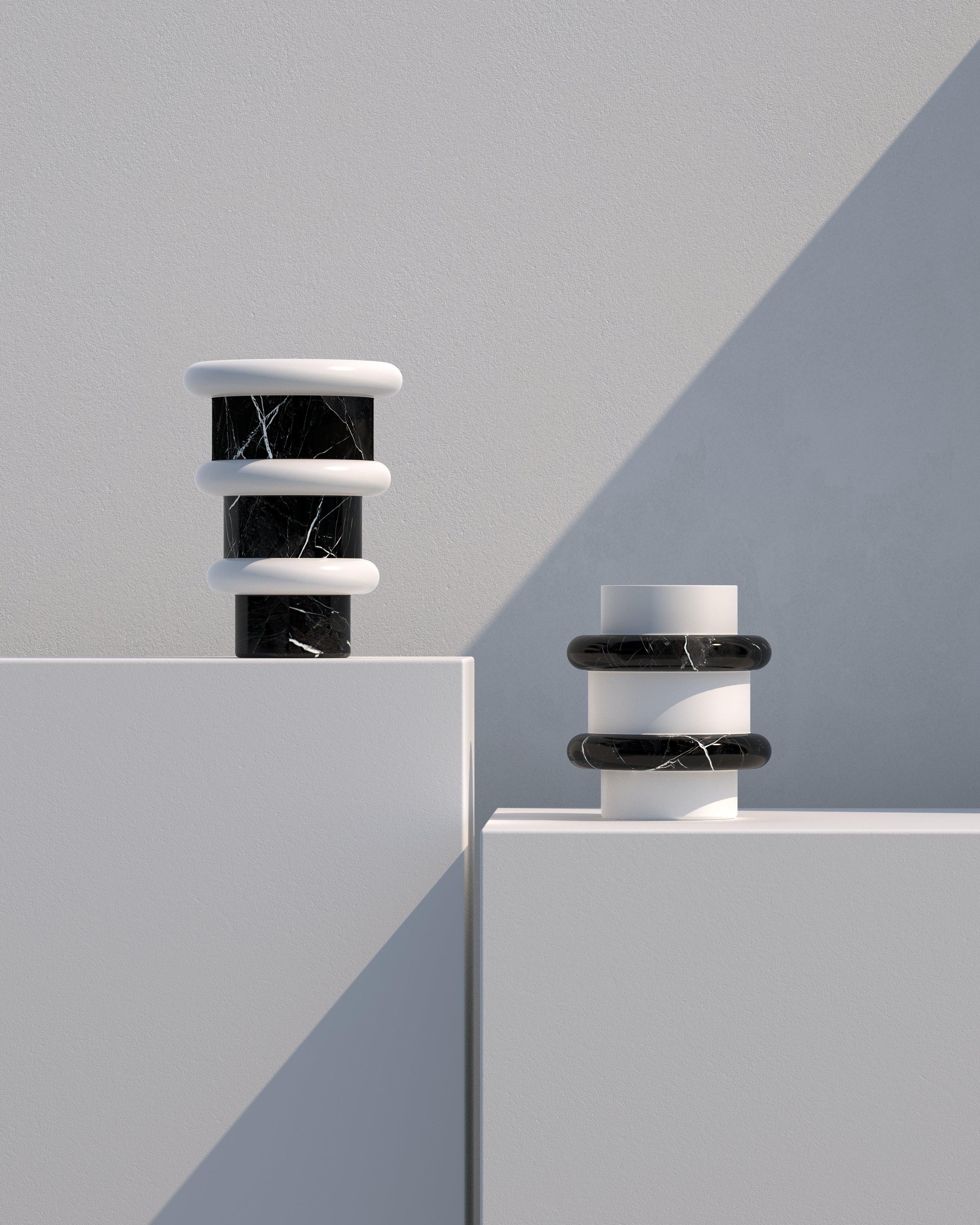 Ce vase minimaliste et ludique dans une combinaison audacieuse de marbre noir et blanc est un article parfait pour ajouter un accent authentique à tout espace intérieur. Fabriqués en Italie à partir de marbre naturel, les vases Lumière offrent des