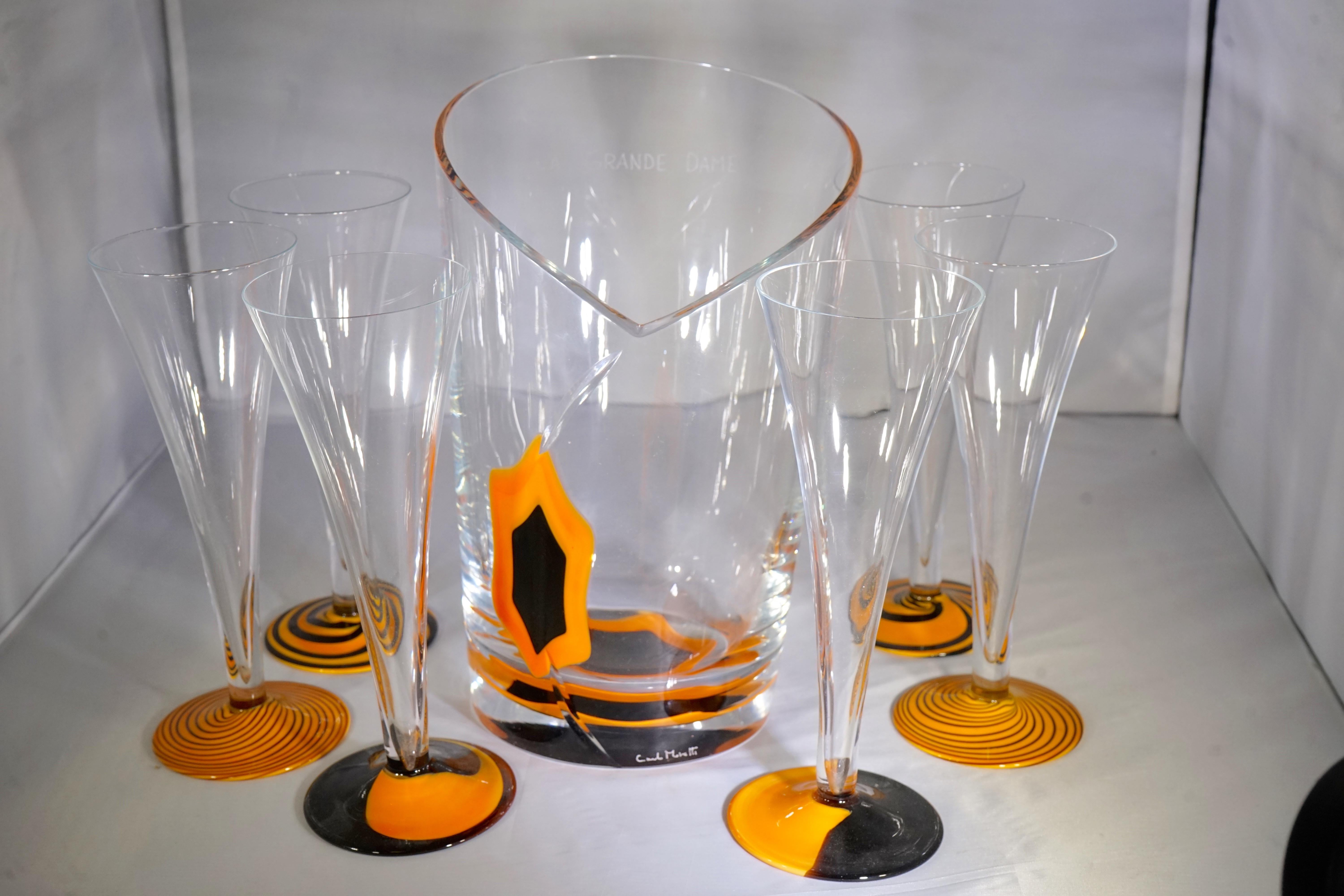 Limited edition Veuve Clicquot La Grande Dame glass with orange and black detail ice bucket and includes six champagne flutes with an orange and black detailed base. Carlo Moretti Signed for Veuve Clicquot.