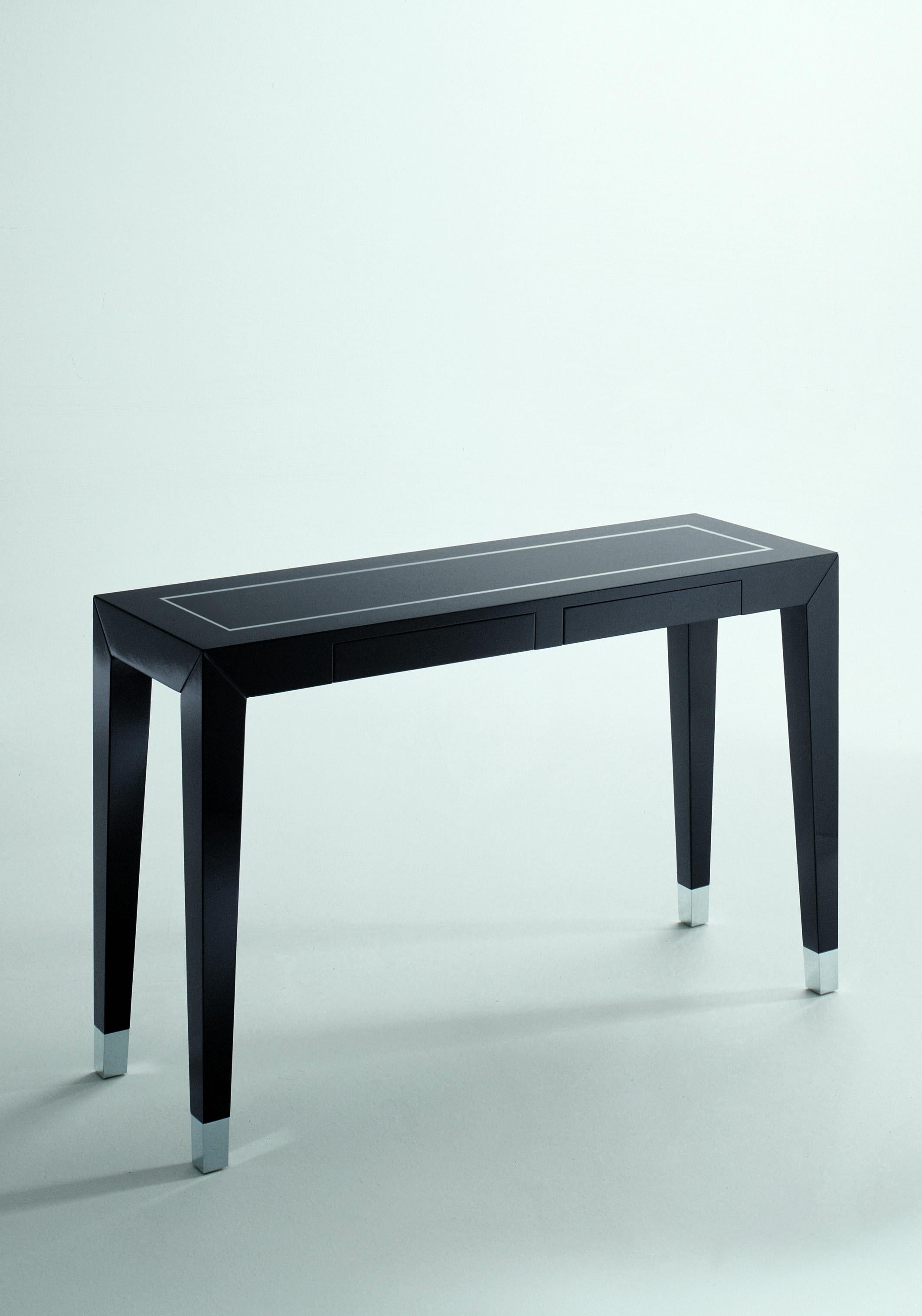 Orson wooden console with polished chromium-plated detail inlaid on the top, n°2 drawers, polished chromium-plated caps and high gloss lacquered black finish.