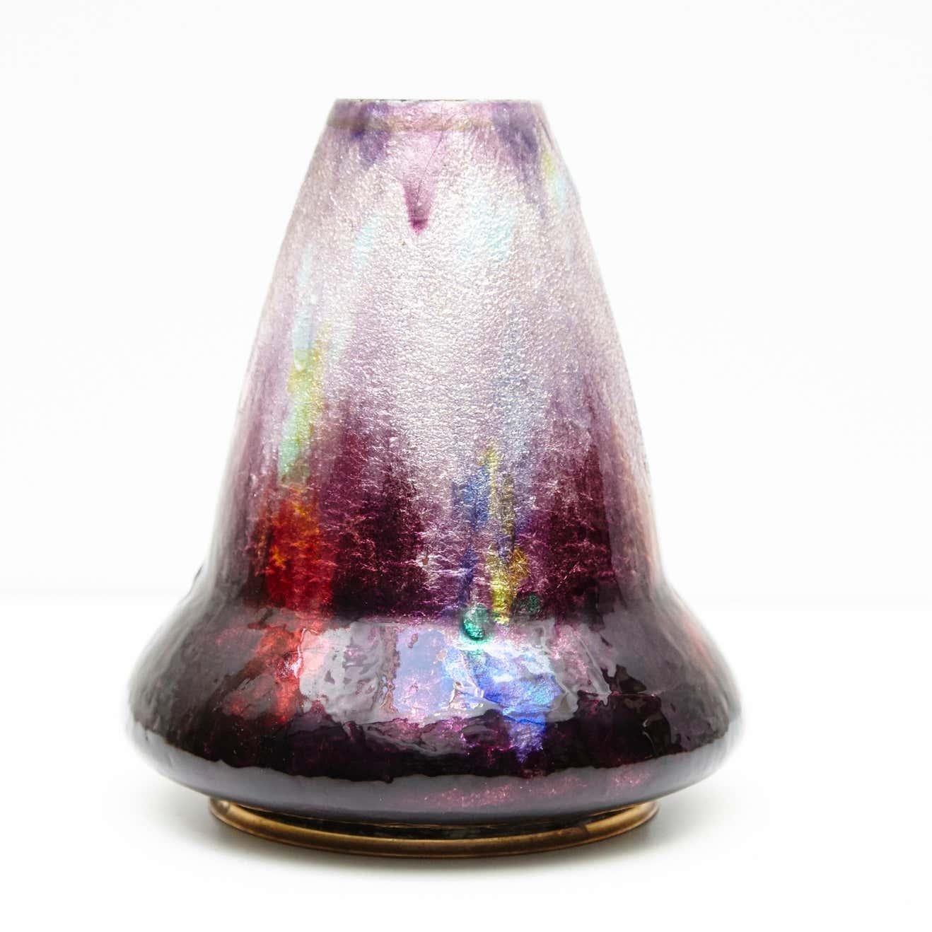 Embrace the elegance of Art Deco with this striking Limoges glass vase by renowned French artist Alexandre Marty. Manufactured circa 1920 in France, this exquisite piece embodies the sophistication and charm of the Art Deco era.

This unique vase is