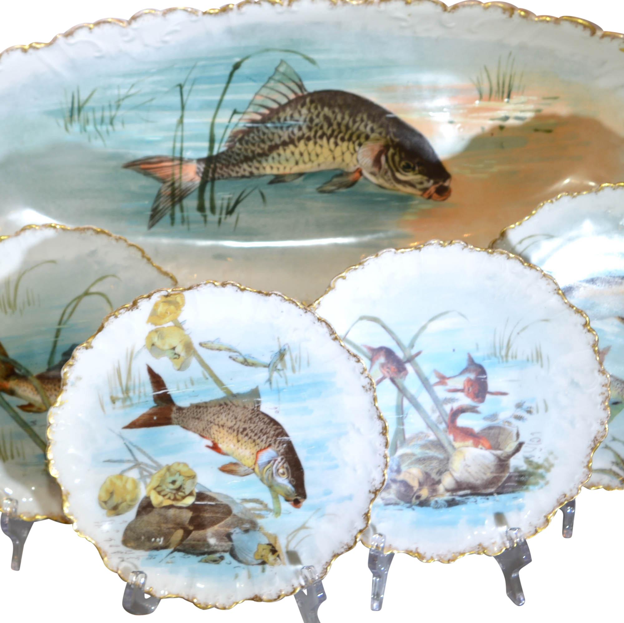 These beautifully hand painted limoges porcelain pieces are sure to get the dinner conversation started. In addition to the detailed center design, the edges feature gold trim details. The set include 12 plates, one large oval platter, and one sauce