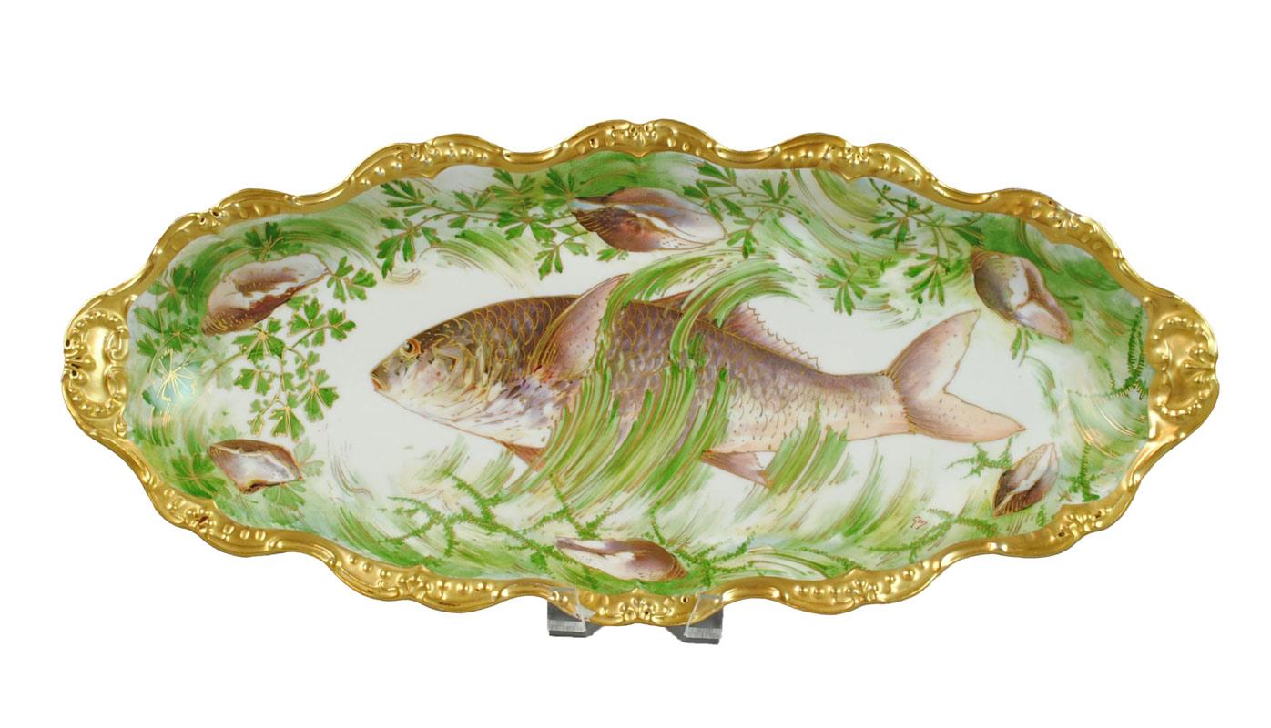 Exceptional limoges porcelain fish service for 12 people. 
With wonderful colors, this antique Limoges set is made with the finest quality by the Coiffe & Cie Company, active under this name between 1891-1914. Paintings signed by Gros.
Each plate