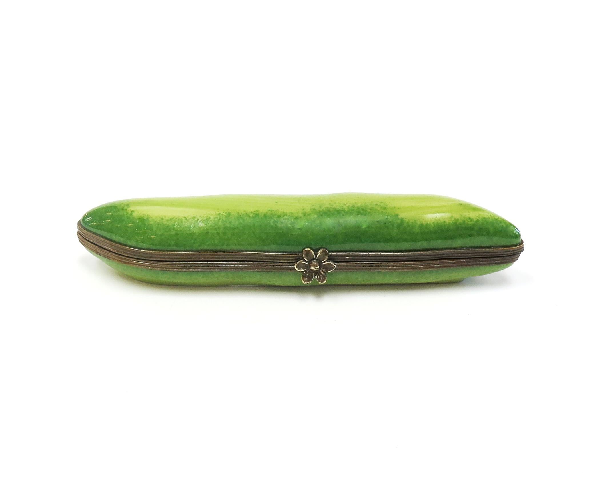 Cute pea pod-form By Tiffany & Co. opens to 7 peas. 
Porcelain with enamel
5.25
