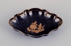 Limoges, France. Bowl and two small trays in porcelain.