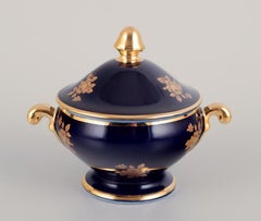 Limoges, France. Coffee cup, sugar bowl, and creamer in porcelain.