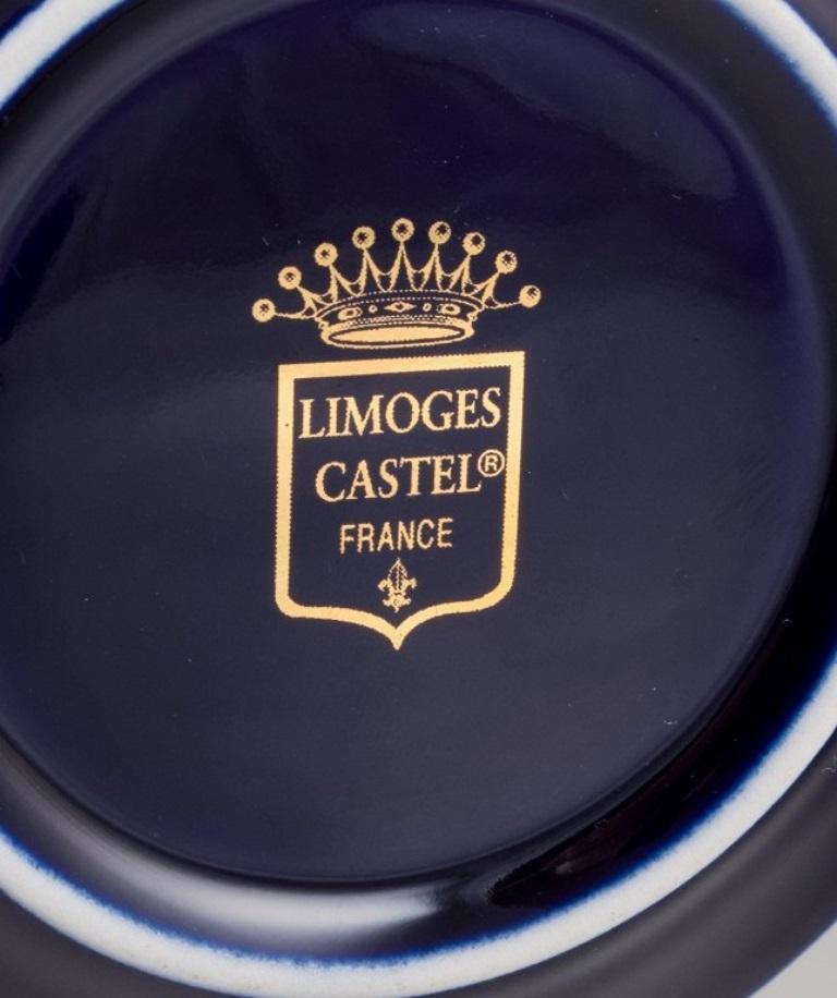 Late 20th Century Limoges, France. Coffee cup, sugar bowl, and creamer in porcelain. For Sale