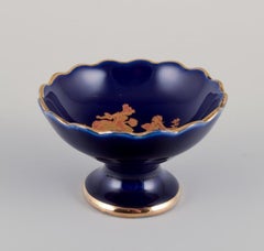 Limoges, France. Five pieces of miniature porcelain decorated with gold leaf.