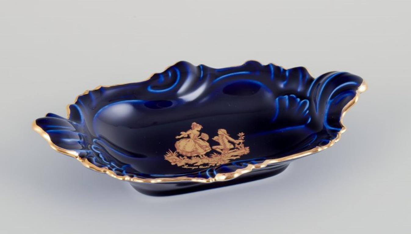 French Limoges, France. Five pieces of porcelain including small trays and bowls For Sale