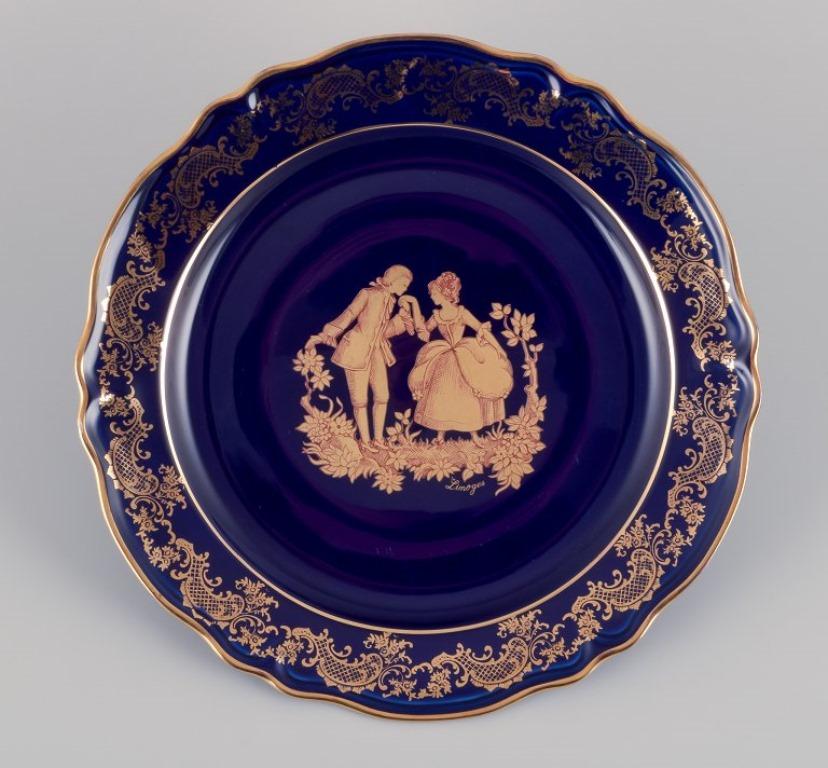 Limoges, Francia. Cuatro platos de porcelana decorados con pan de oro de 22 quilates. Glaseado en venta