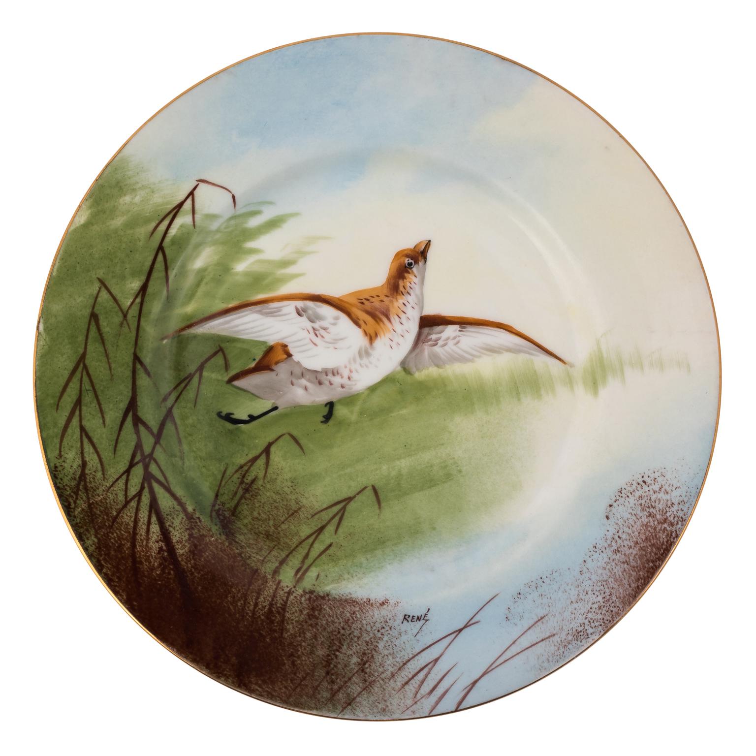 Limoges France hand painted Artist-signed game bird set of 13 pieces with large plater. Measures: 18.50 inch by 12.00 inch plates- 9 3/4 inch diameter. All plates signed Rene.
 