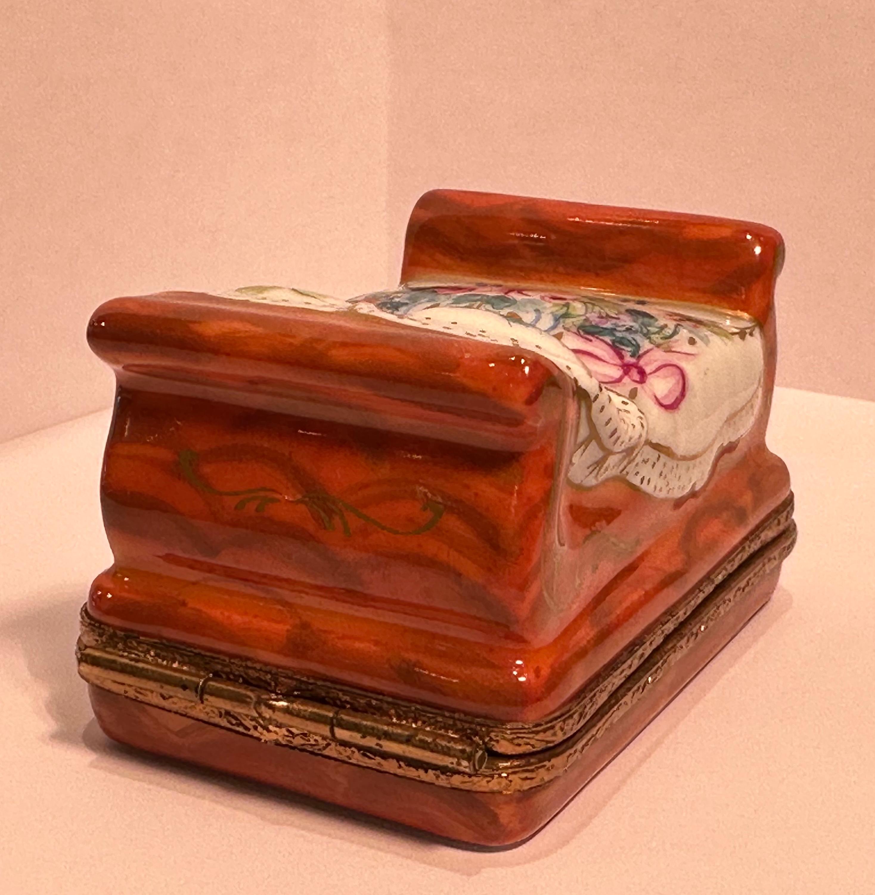 Collectible and very unique, Limoges porcelain miniature trinket box is handmade and hand painted in France and features a very detailed French style sleigh bed with hand painted scroll motifs.  The fancy antique gold gilt finish ormolu mounts add