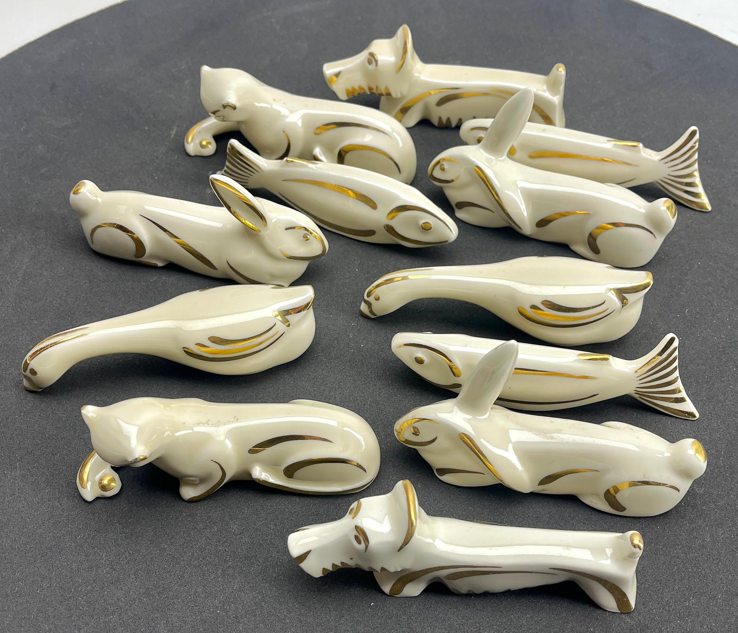 This is a set of 10 pieces in porcelain with hand applied gold highlights 
Cute additions for a formal table.
Limoges is one of the best porcelain factories in France.

Please don't hesitate to get in touch with any further questions.
Best Regards