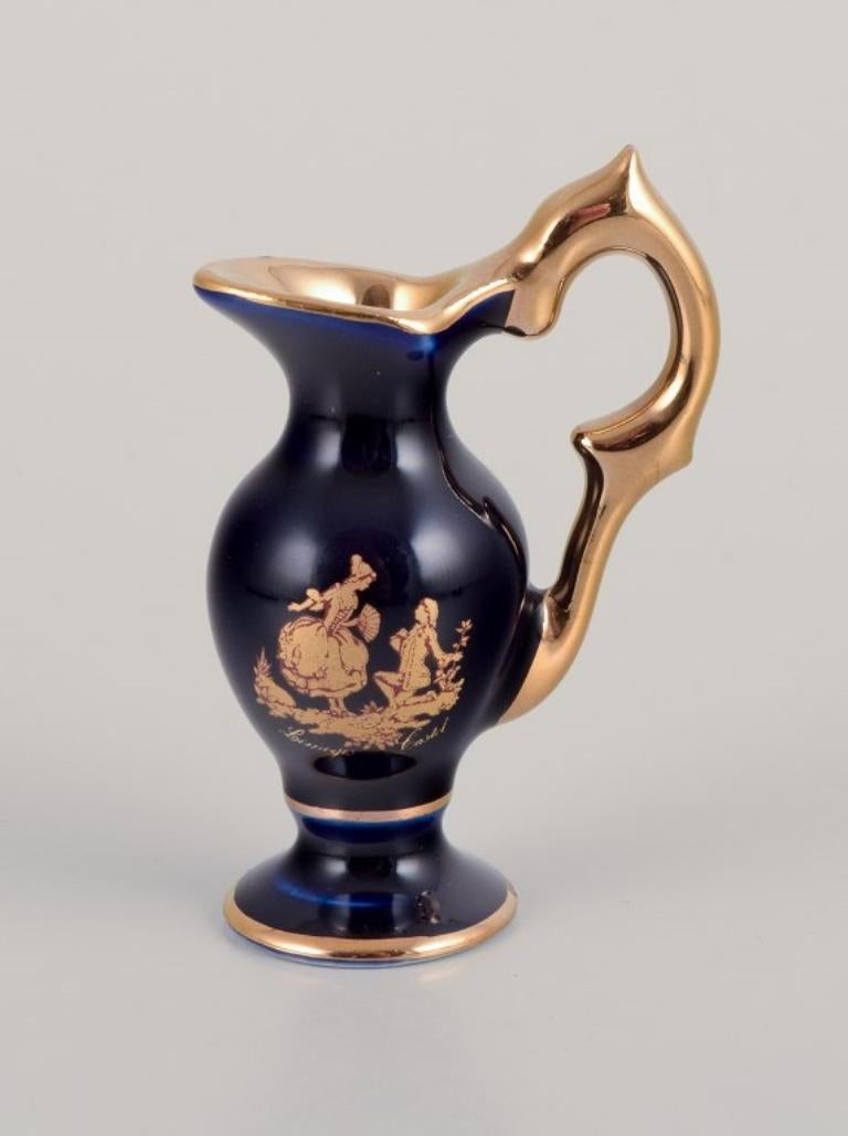 Limoges, France. Miniature porcelain set: cup, teapot, two pitchers and tray In Excellent Condition In København, Copenhagen