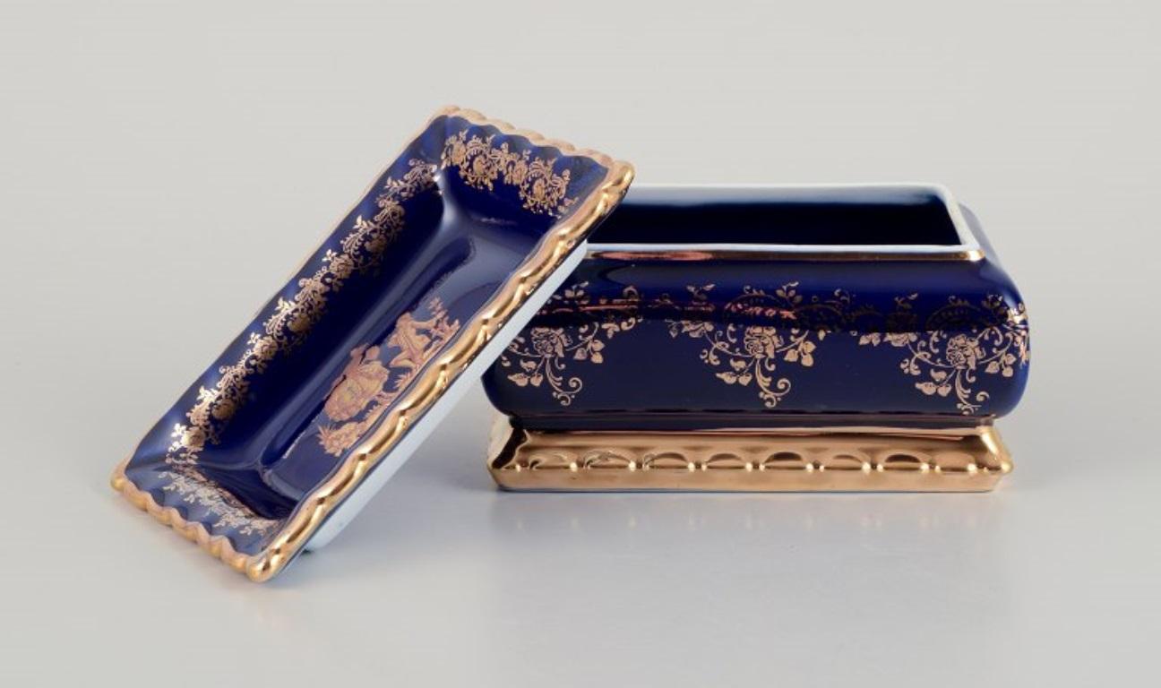 French Limoges, France. Porcelain covered box decorated with 22-karat gold leaf. For Sale