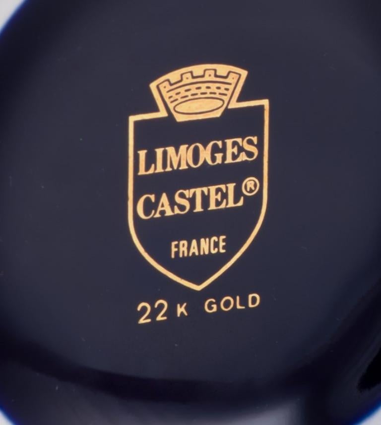 Glazed Limoges, France. Porcelain perfume atomizer and makeup mirror.