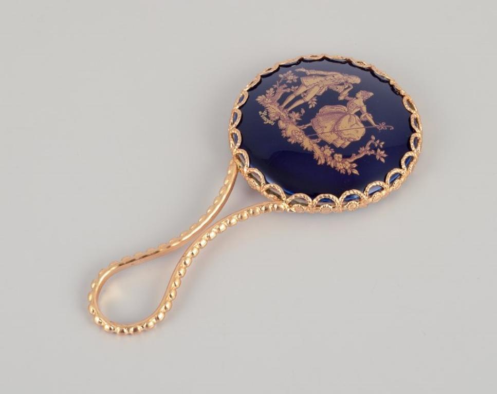 Late 20th Century Limoges, France. Porcelain perfume atomizer and makeup mirror.