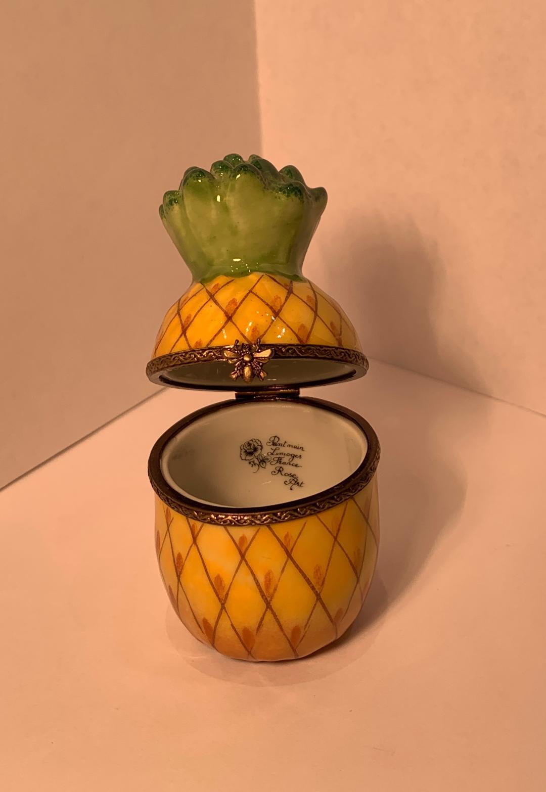 Collectible, handmade and hand painted Limoges porcelain trinket box depicts a miniature pineapple. The pineapple is the ultimate symbol of Southern hospitality and once represented unreachable wealth. The pineapple now represents warm welcomes,