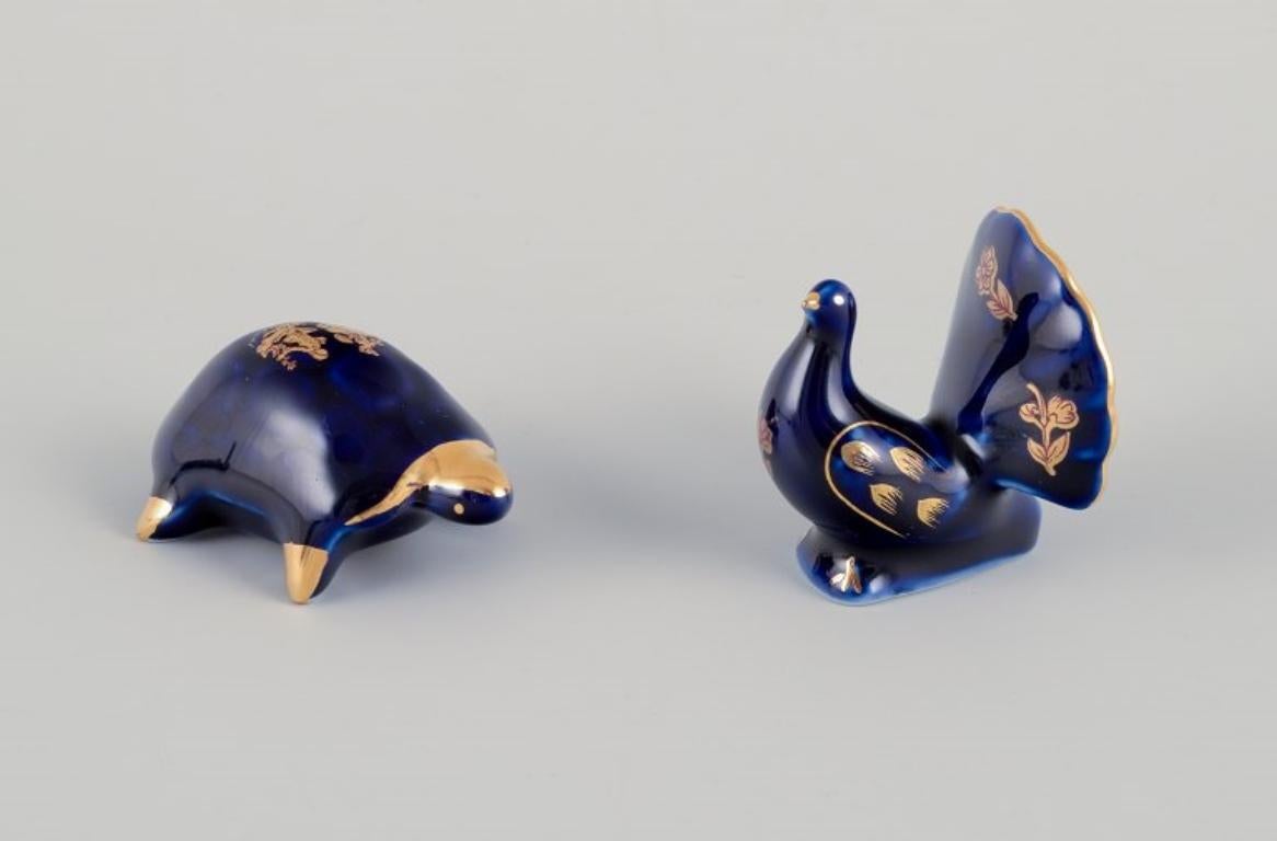 Limoges, Frankreich. Sieben Miniatur-Tiere aus Porzellan. Ca. 1970 (Glasiert) im Angebot
