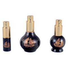 Limoges, France. Three porcelain perfume bottles.