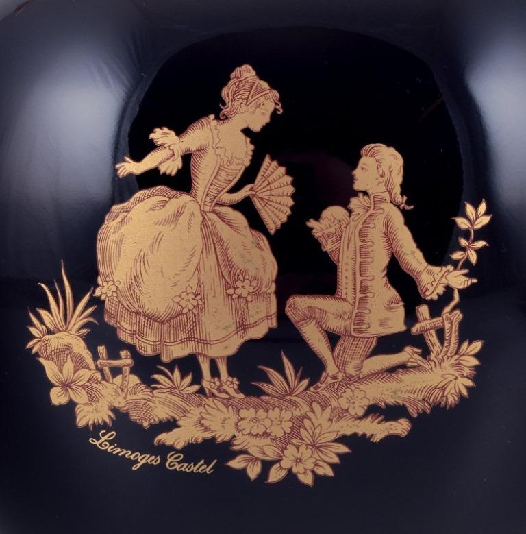 French Limoges, France. Three porcelain vases decorated with 22-karat gold leaf.