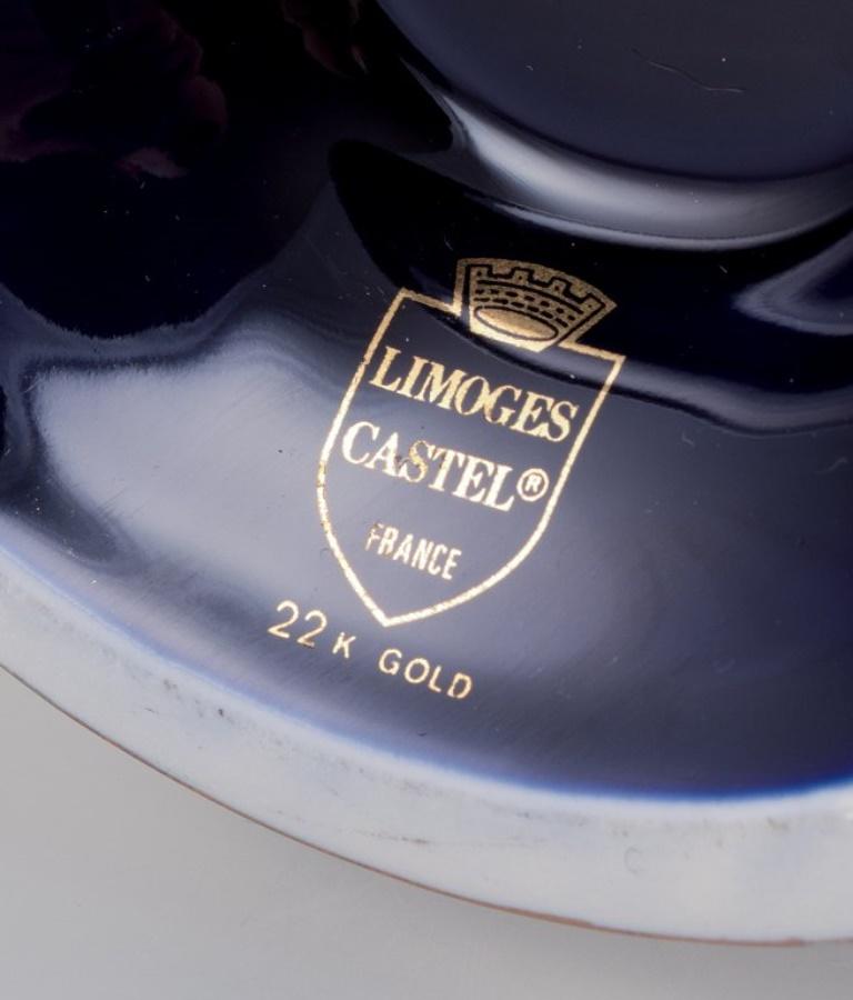 Glazed Limoges, France. Three porcelain vases decorated with 22-karat gold leaf.