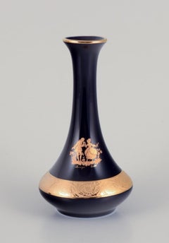 Limoges, France. Three small porcelain vases decorated with 22-karat gold leaf