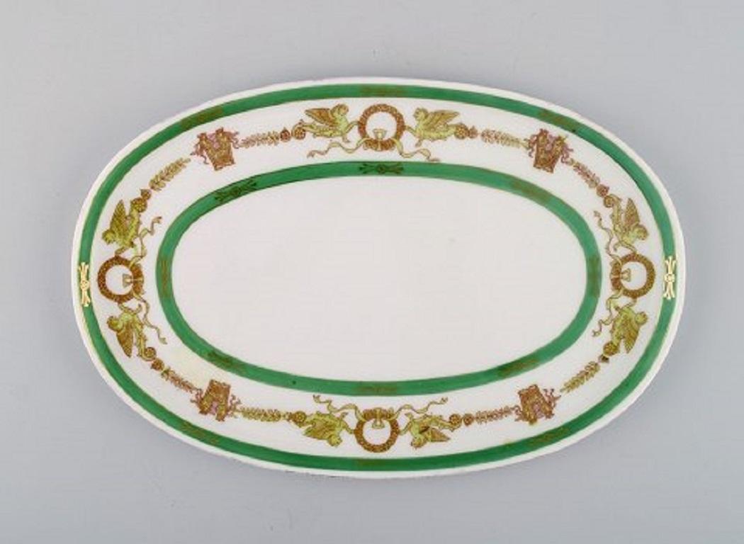 Limoges, France. Two candlesticks and a dish in hand painted porcelain with a green edge and gold decoration, 1930s-1940s.
The candlestick measures: 16 x 8 cm.
The dish measures: 23.5 x 15.5 cm.
In excellent condition.
Stamped.