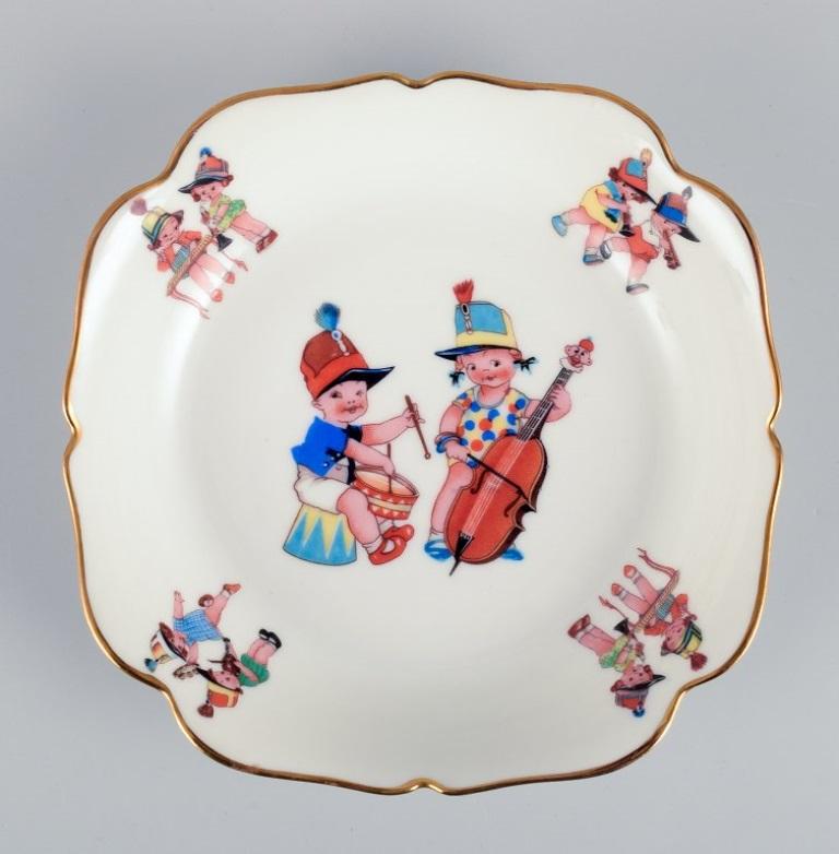 Limoges, France. Two deep children's plates in porcelain with gold rim.  In Excellent Condition For Sale In Copenhagen, DK
