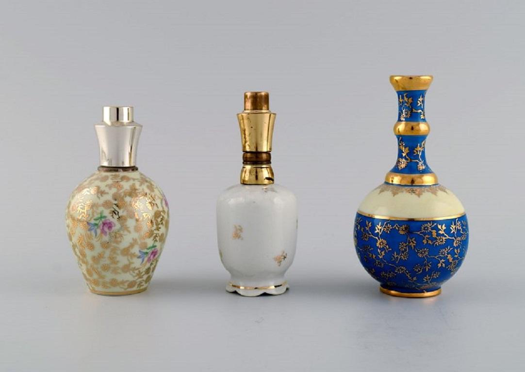 Limoges, France. Two perfume bottles, three vases and lidded box in porcelain. In Excellent Condition For Sale In Copenhagen, DK