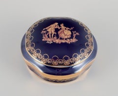 Limoges, France. Two porcelain boxes / jars decorated with 22-karat gold leaf