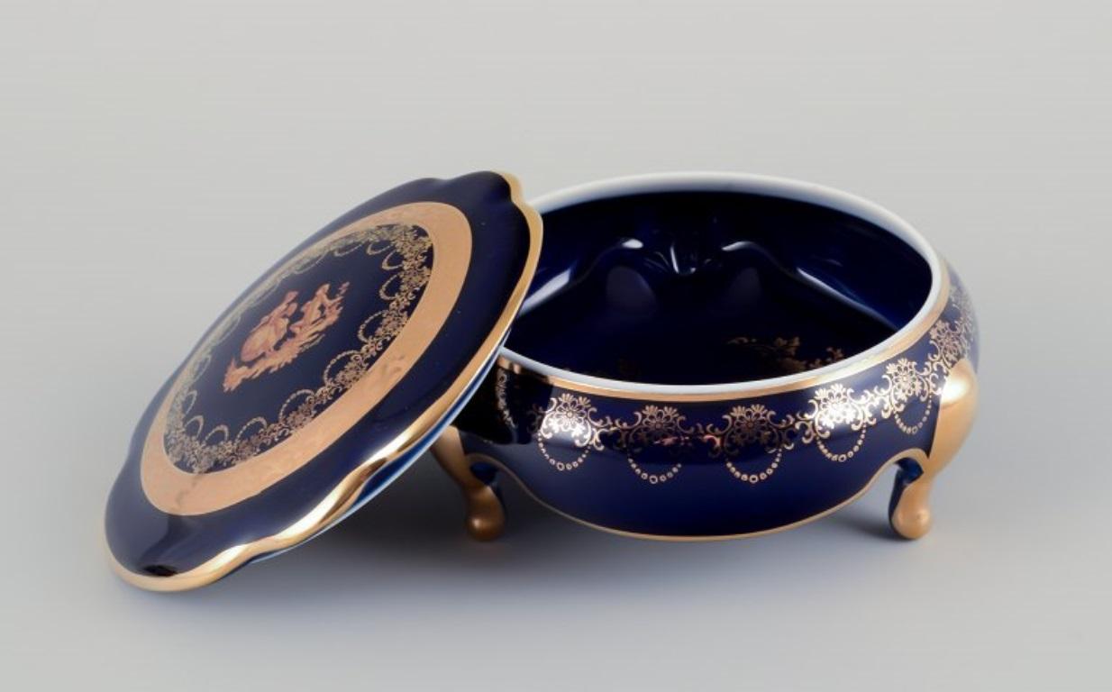 French Limoges, France. Two porcelain boxes /  jars decorated with 22-karat gold leaf. For Sale