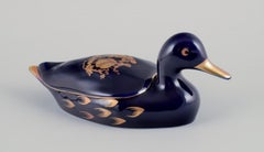 Limoges, France. Two porcelain ducks decorated with 22-karat gold leaf.