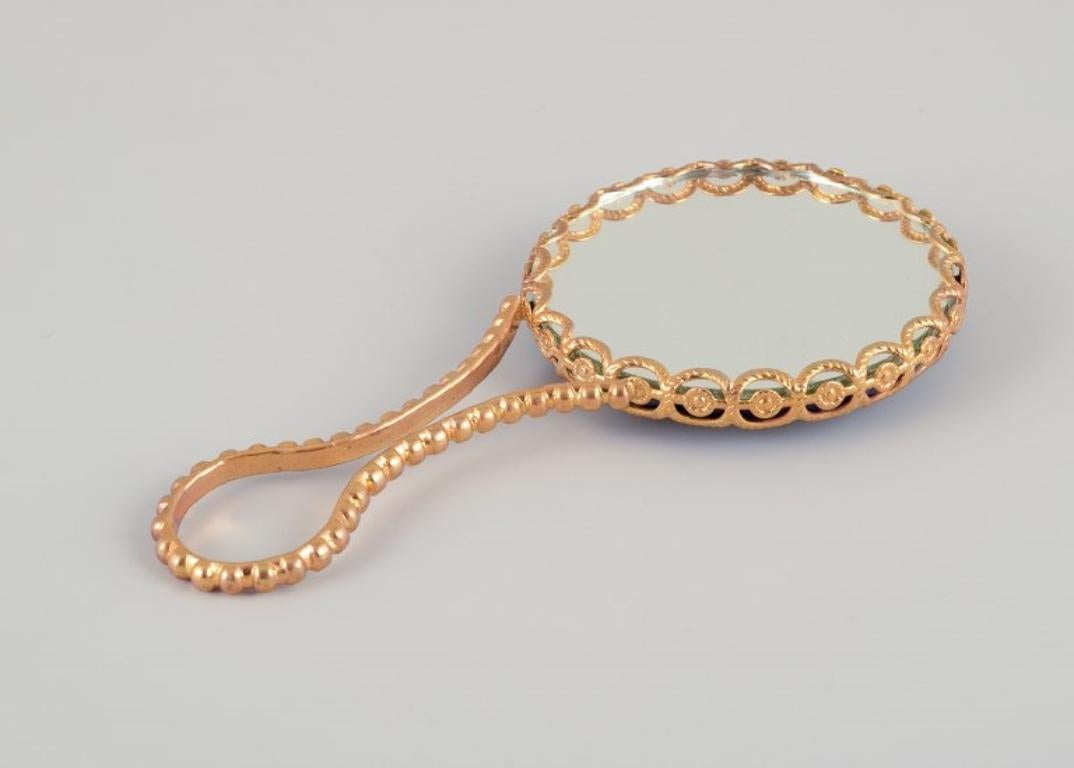 Late 20th Century Limoges, France. Two porcelain perfume atomizers and a makeup mirror