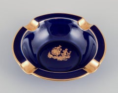 Limoges, France. Two small porcelain bowls decorated with 22-karat gold leaf.