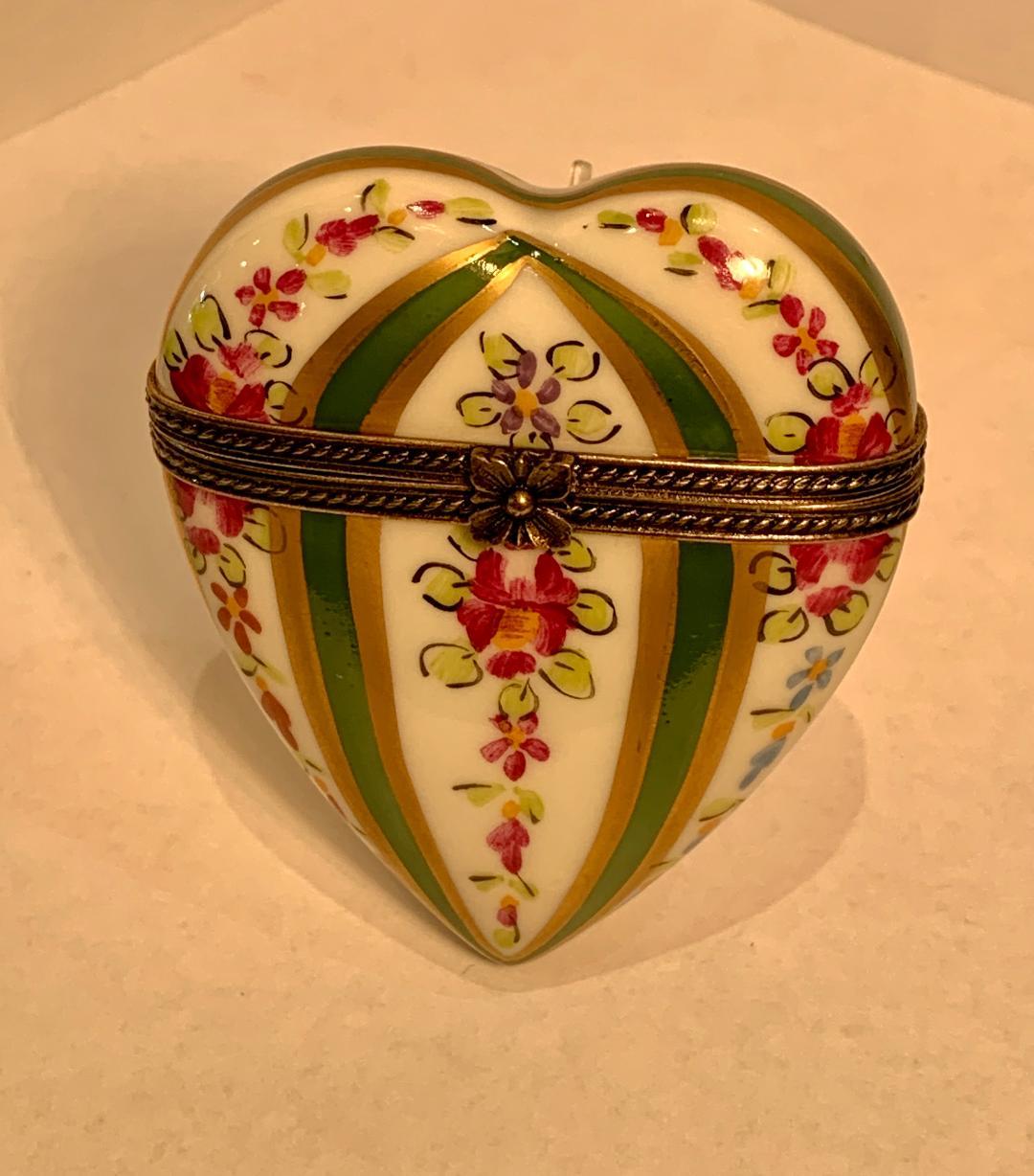 Make that special someone in your life very happy this Valentine's Day or any occasion with this collectible, handmade and hand painted, Limoges porcelain small heart shaped trinket box featuring a beautifully decorated colorful cascading floral