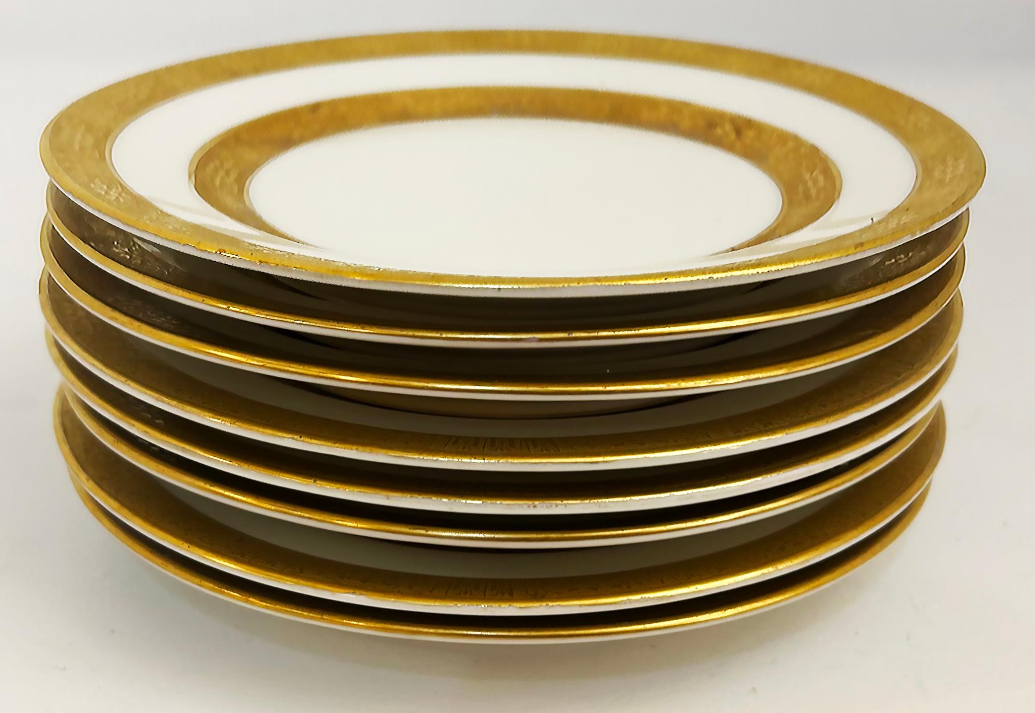 Limoges Gilt Banded Porcelain Plates Retailed by Stern Brothers NY Set of 8

Offered for sale is a set of eight gilt-banded Limoges plates with patterned gold on gold designs. The plates are marked Limoges and also Stern Brothers on the bases.