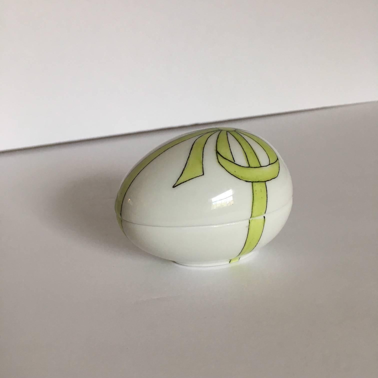 Delightful French Limoges white egg shaped box, decorated with a green ribbon and bow by Chamart Limoges. Perfect for a Mother's Day gift, or for the Limoge collector. From a large estate collection of Limoges boxes.