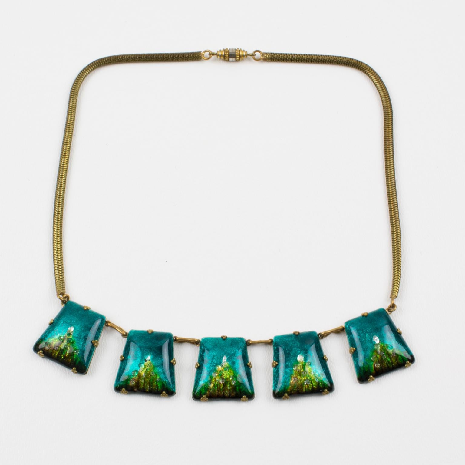 A charming enamel and pate de verre link choker necklace made in Limoges, France. Enameled domed trapeze copper elements are hinged together with brass framing to a turbogas or serpentine chain. This popular 1950s and 1960s technique named 