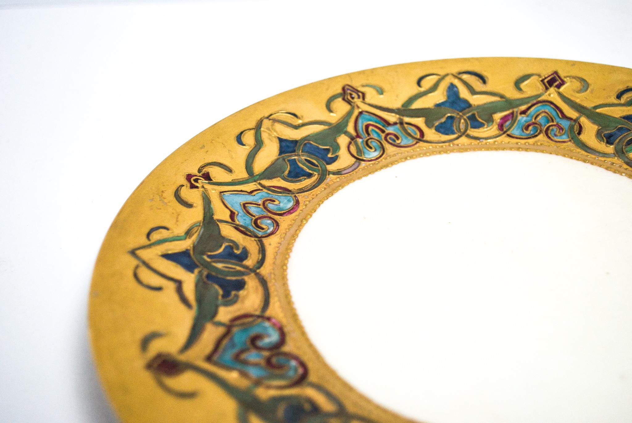 This stunning hand painted gilded plate is sure to impress. The J.P.L. mark on the back dates the piece to 1906-1932.

The Pouyat family was one of the oldest French names connected with the Limoges porcelain industry. Jean Pouyat's grandfather