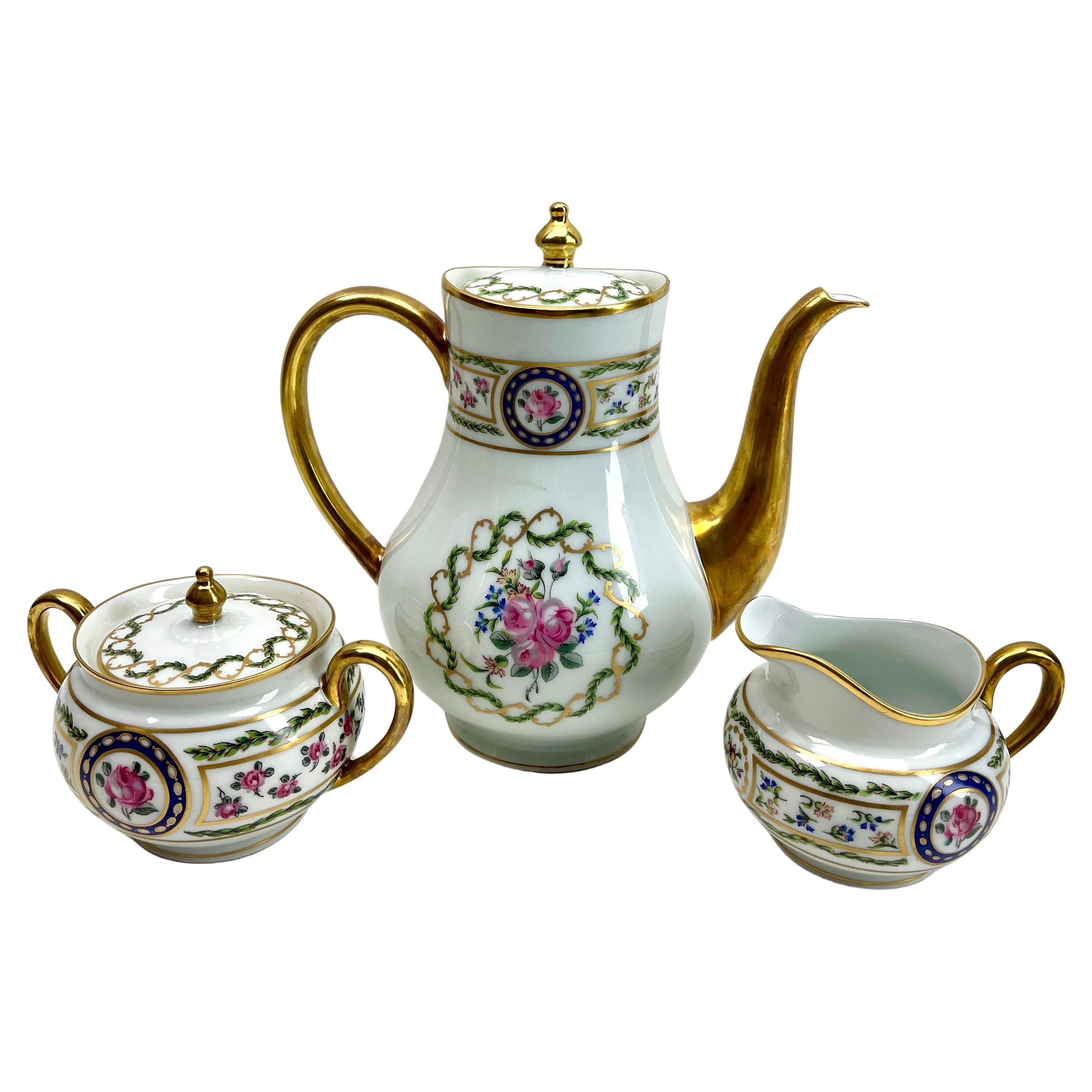 This is a set of 9 pieces Limoges Louveciennes porcelain with hand applied gold highlights and Flowers decoration
Cute additions for a formal table.

Limoges is one of the best porcelain factories in France.

Please don't hesitate to get in touch