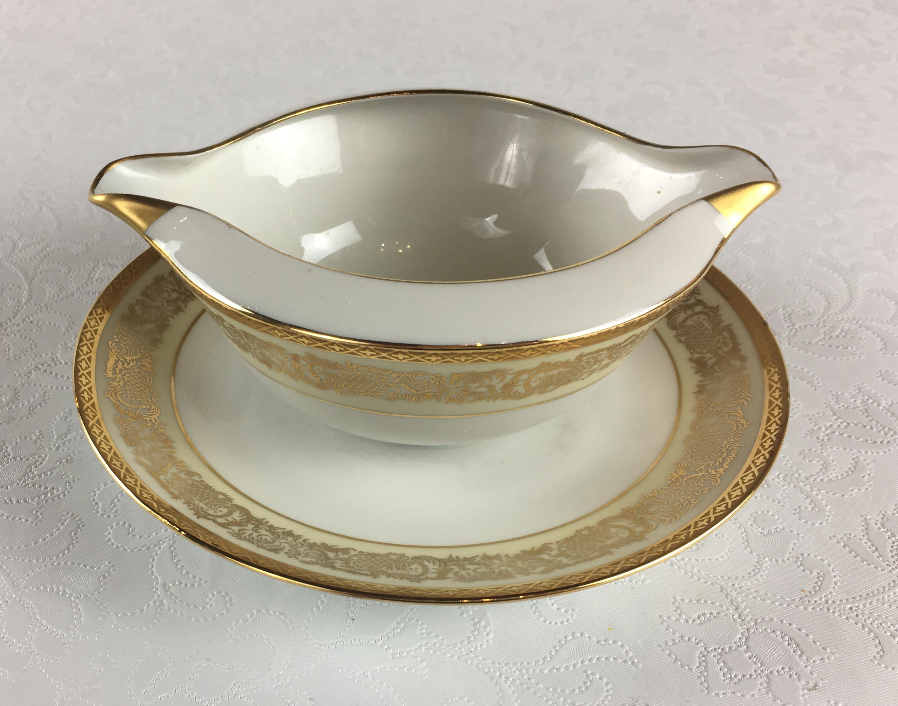 Hand-Crafted Neoclassical Limoges Porcelain Gold Rimmed Dinner Service 70 pieces, Signed For Sale