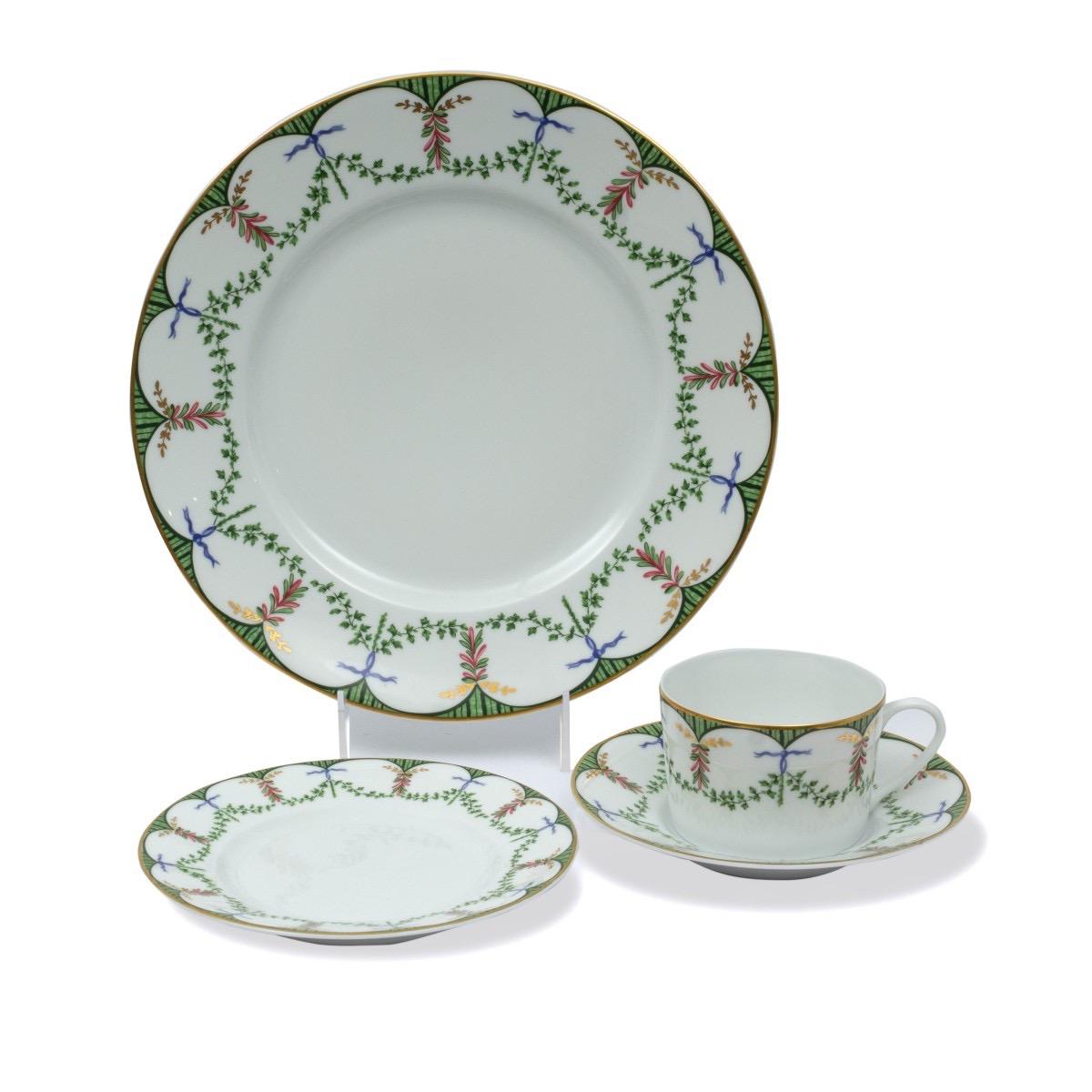 A set of 12 place settings in the Festivites pattern by Raynaud. This pattern is currently discontinued, made in Limoges, France from 1986-2013.

Includes the following pieces (a total of 48):
12 dinner plate - 10.75