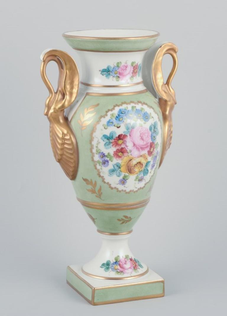 French Limoges/Sevres, France. Porcelain vase on a pedestal, handles shaped like swans.