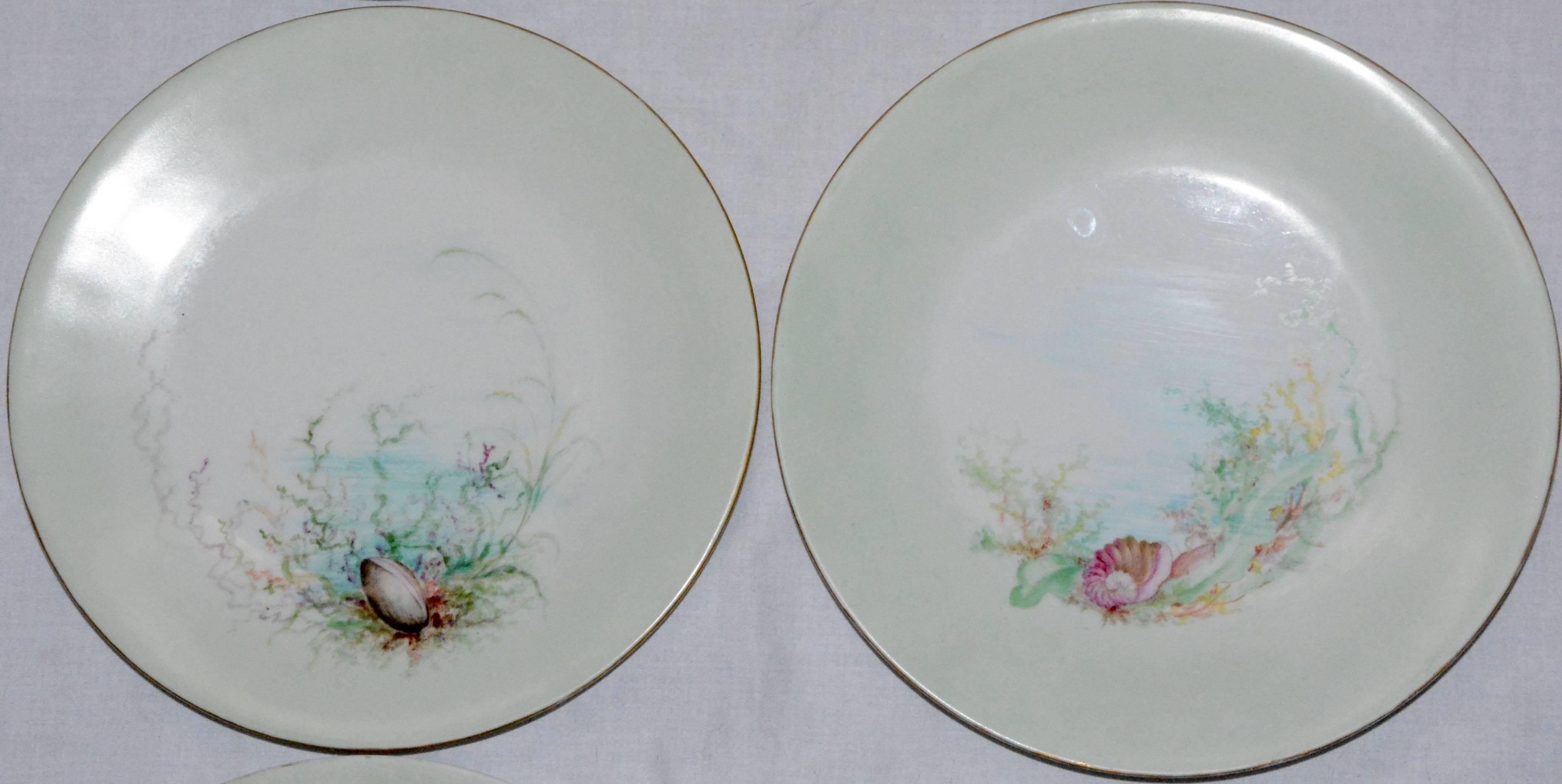 We are offering a fabulous set of six dinner plates with a variety of seashell scenes. Two of the plates are signed on the back by M.H. Dismukes and dated 1898. The perimeter of the plates are tinted a soft green and the edges are rimmed in gold.
