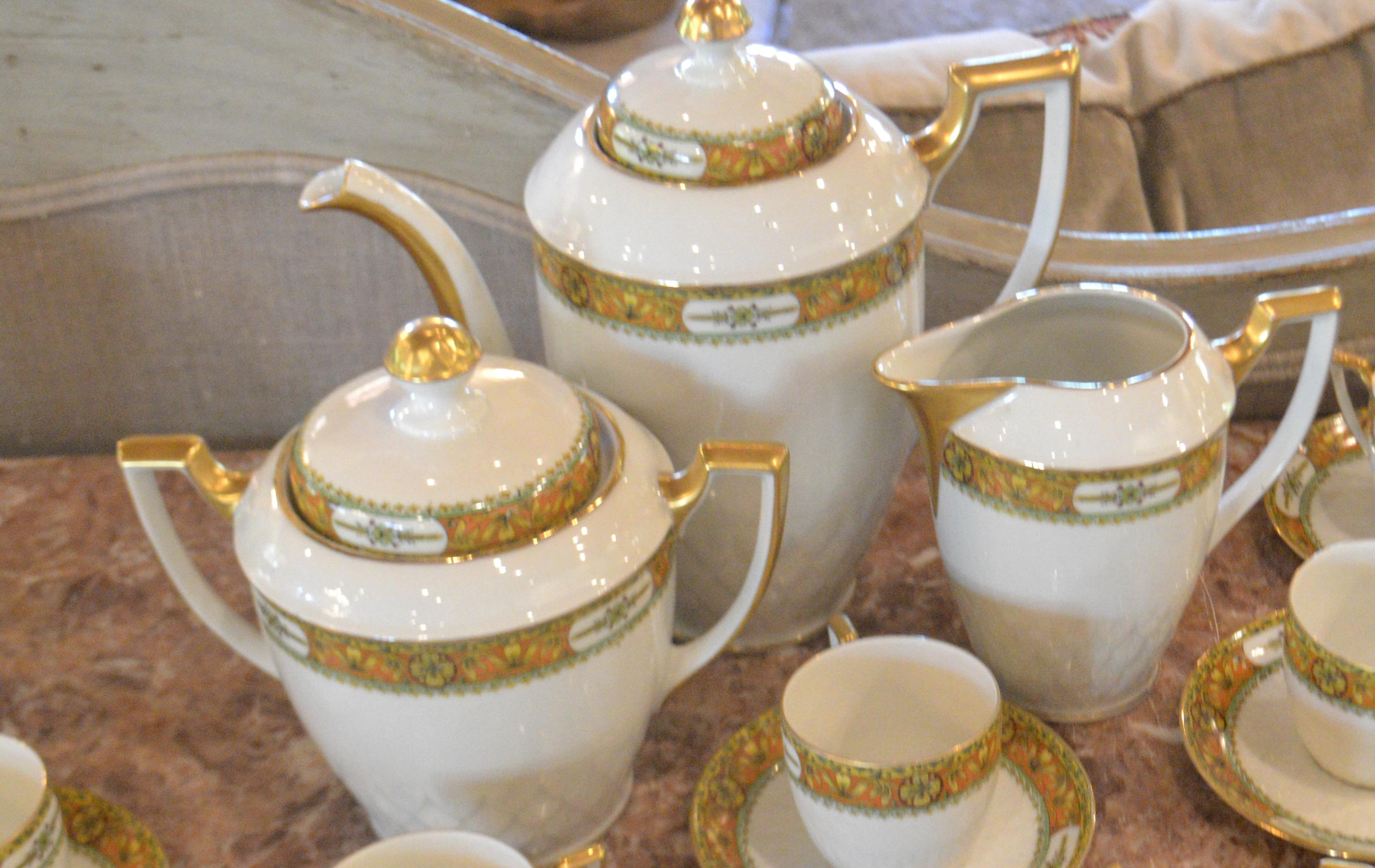 Limoges tea set, service for 6, plus 1. Gold Farmhouse collection, France, perfect condition, 7 cups and saucers, coffee/tea pot, creamer and sugar.