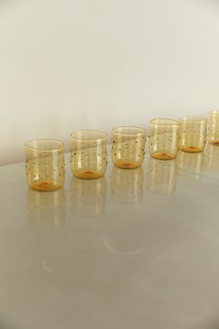 Limoncello contemporary handmade blown glasses. Tinted yellow with green dots