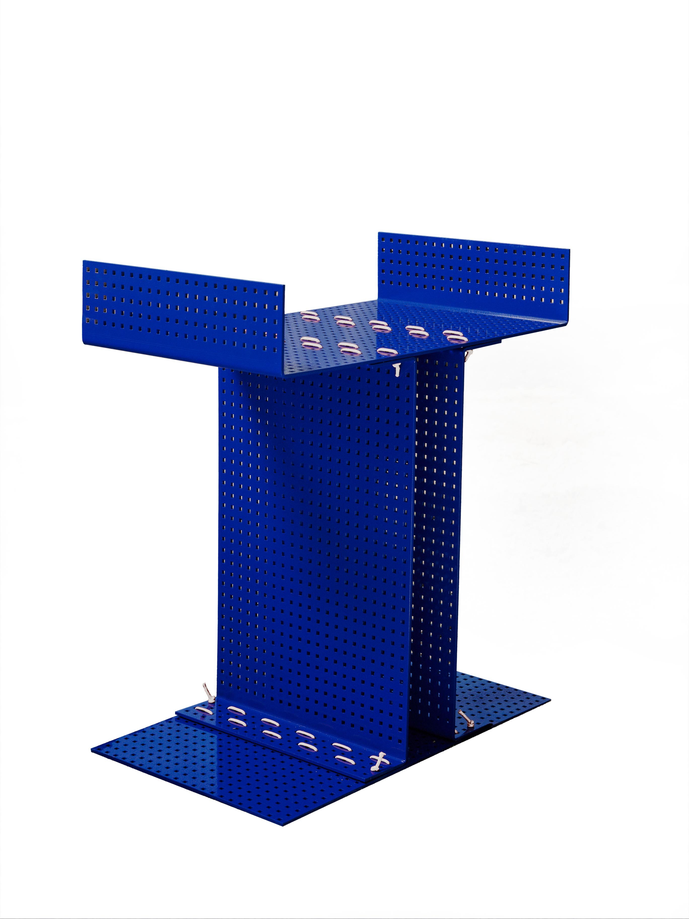 Iron blu coffee table with white strings
a piece of furniture that is defined by its user. Lina tries to find the essence of itself. A monolith made up of 4 slabs sewn together becomes a seat or a small table or they can be stacked and create a