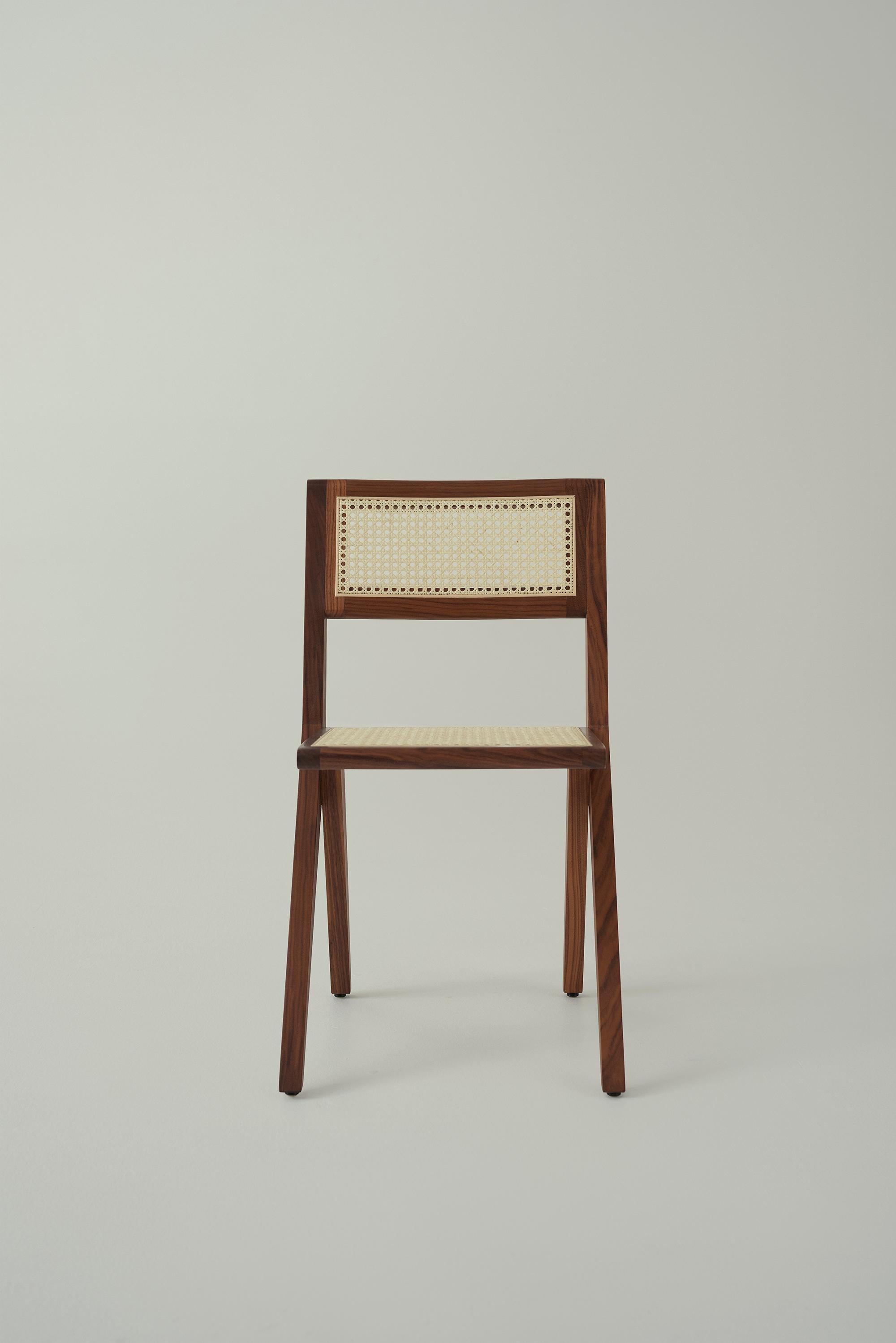 In the spirit of early Brazilian modernism, the Lina chair is an elegant combination of the primitive and contemporary. With a tapered structure and form composed of long lines and cantilevers, the rattan backrest and seat brings comfort and