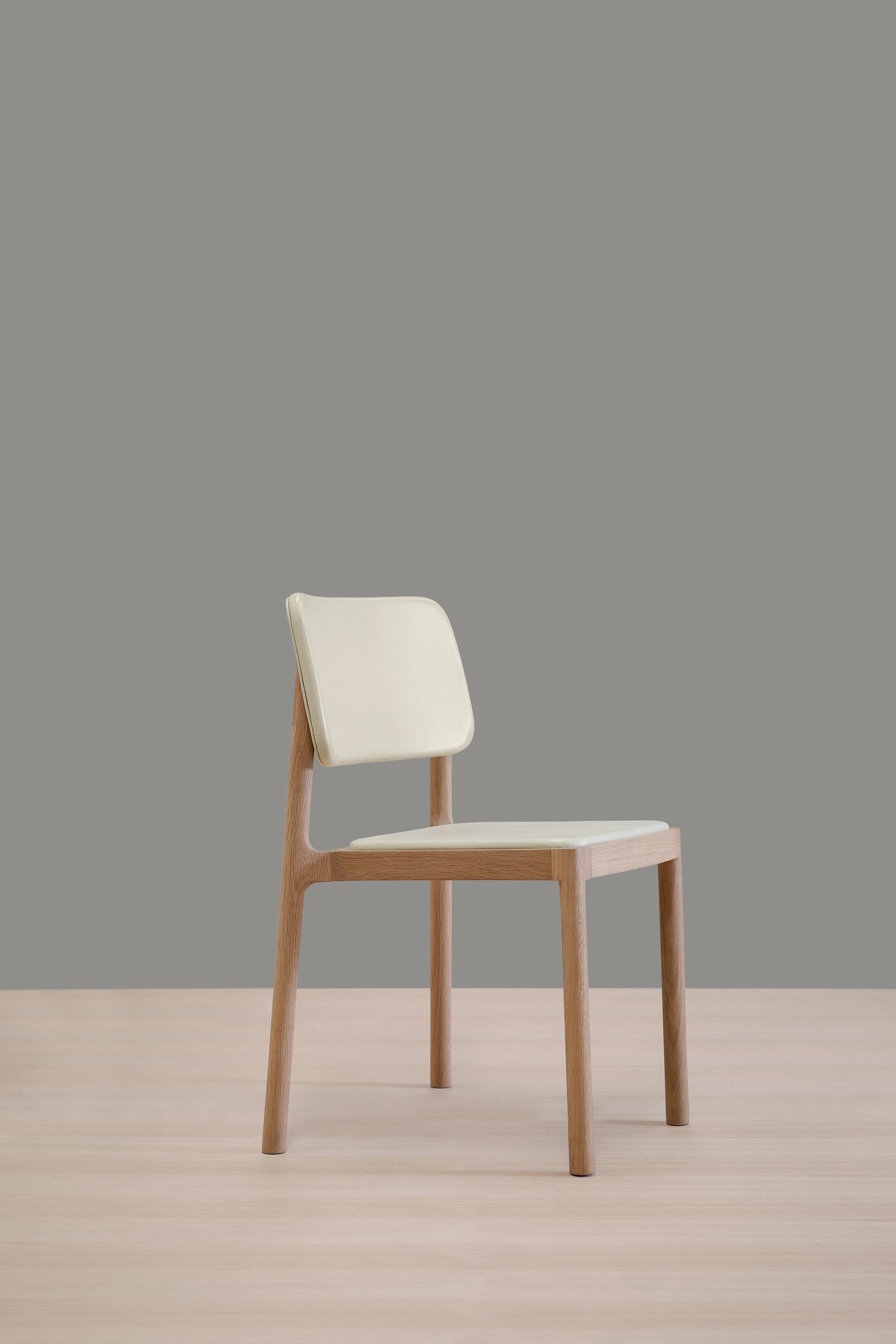 Linard dining chair by Thai Hua
Dimensions: D 57 x W 48 x H 81 cm
Materials: oak wood, leather.

Dining chair made of solid holm white oak and leather.

Thai Hua is an industrial designer originally from Vietnam trained in Switzerland. Since